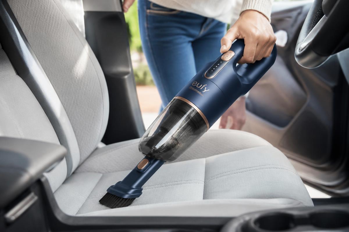 Portable Handheld Vacuum™ cleaning a fabric car seat